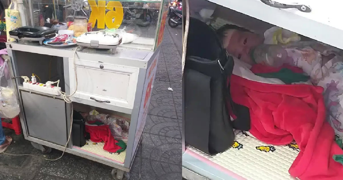 Heartbreaking Image Shows Baby In Mobile Bread Cart Feeding Herself While Mom Works